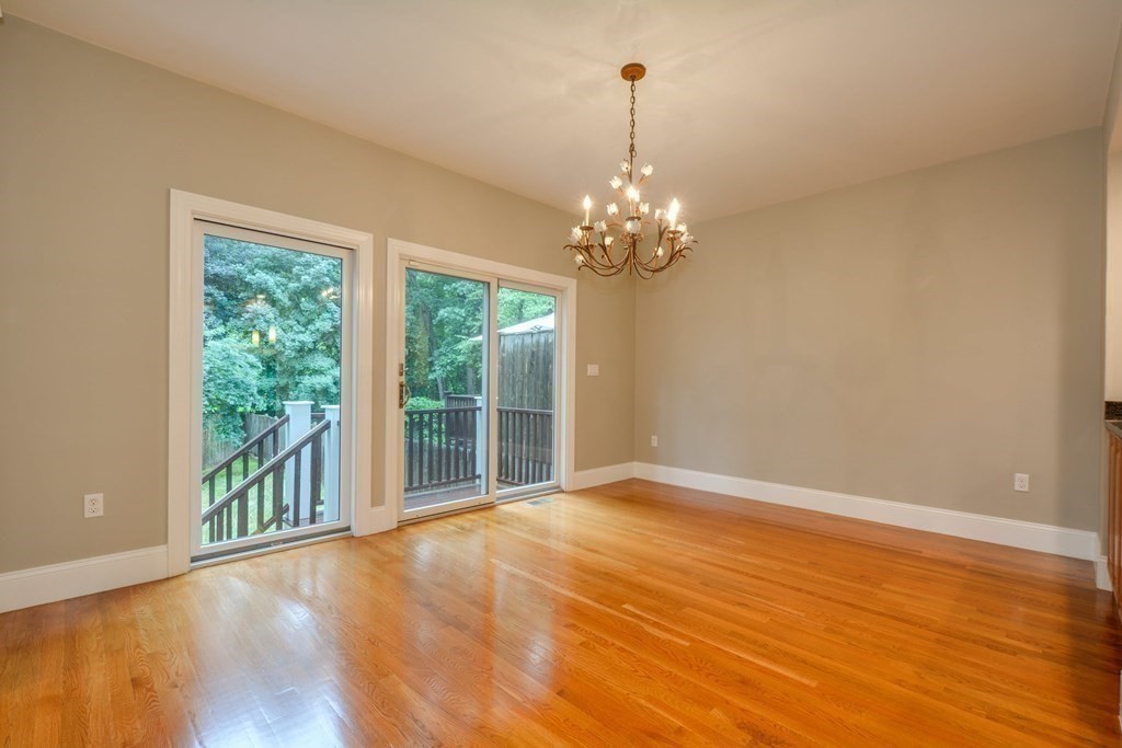 50 Tanglewood Road Newton, MA 02459 - Photo 41 of 42 a view of an empty room with wooden floor and a window