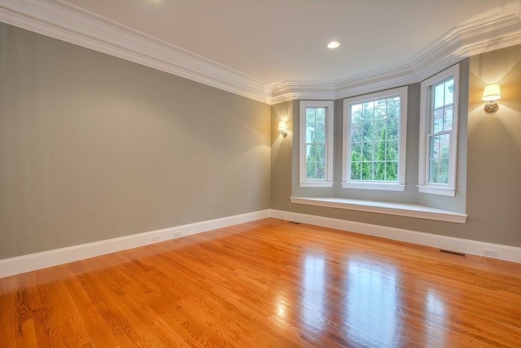 50 Tanglewood Road Newton, MA 02459 - Photo 6 of 42 a view of an empty room with wooden floor and a window