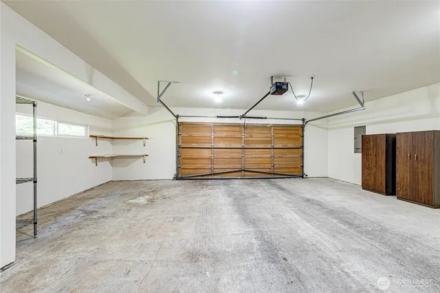 a view of room and a garage