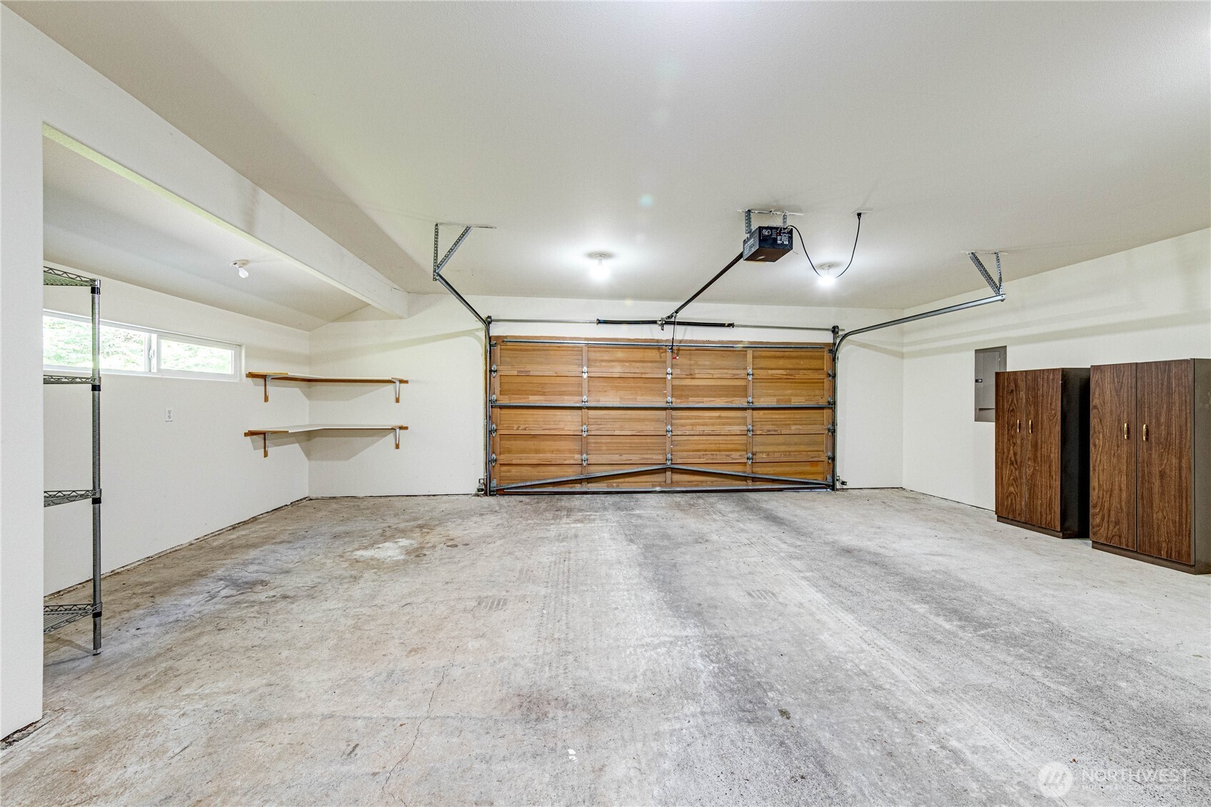 109 Vancouver Place Sequim, WA 98382 - Photo 17 of 40 a view of room and a garage