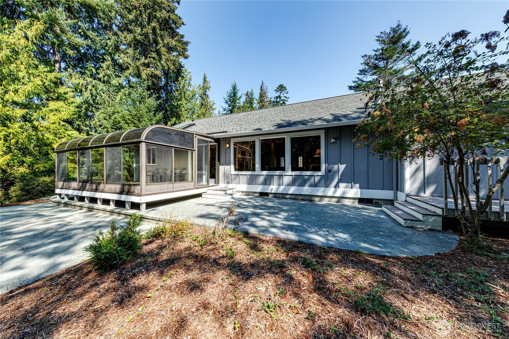109 Vancouver Place Sequim, WA 98382 - Photo 32 of 40 a view of a house with backyard and sitting area