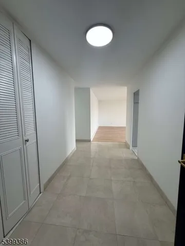 a kitchen with stainless steel appliances a sink a stove and cabinets