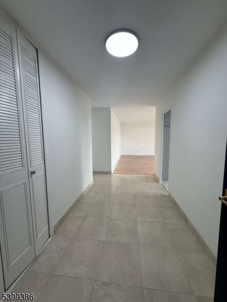 1 Claridge Drive, Unit 428 Verona, NJ 07044 - Photo 7 of 17 a view of an empty room and a window