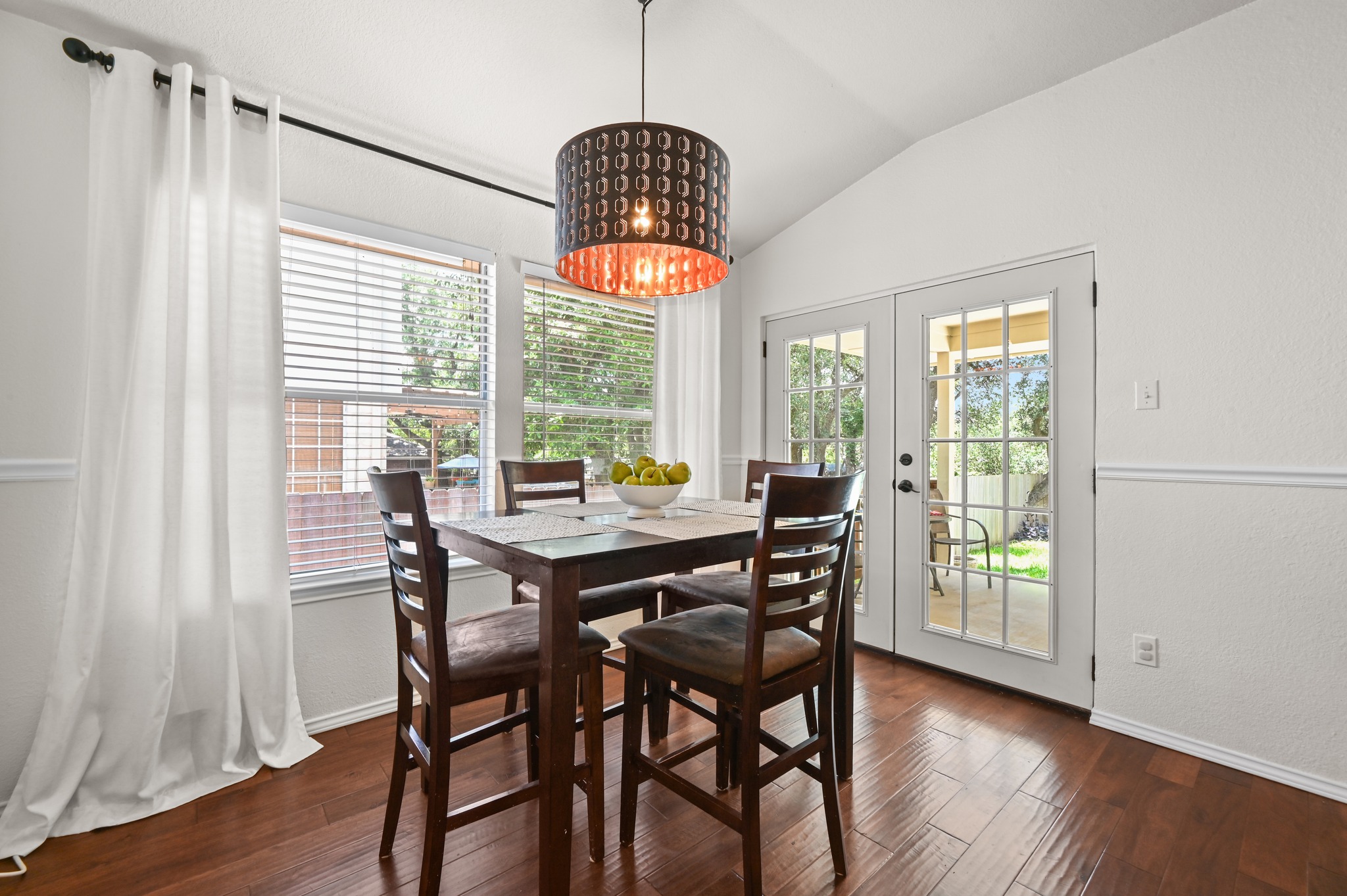 1409 Knoll Ridge Drive Cedar Park, TX 78613 - Photo 11 of 30 Hardwood floors and an inviting patio access create a welcoming ambiance for gatherings.