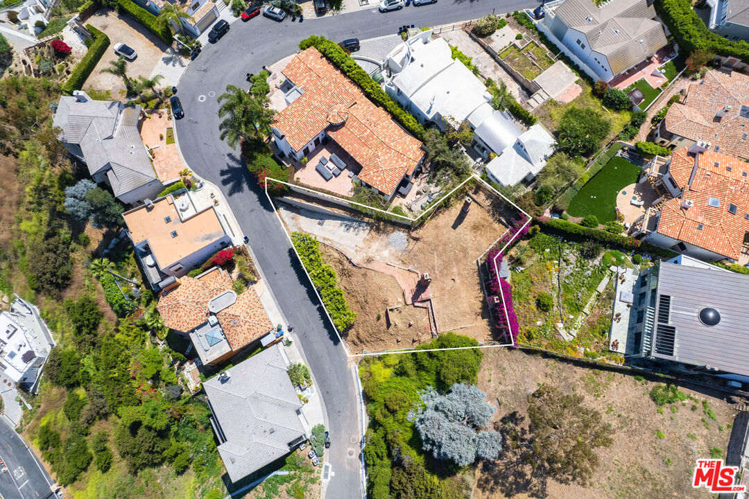 3851 Rambla Orienta Malibu, CA 90265 - Photo 7 of 12 an aerial view of a house with a yard and lake