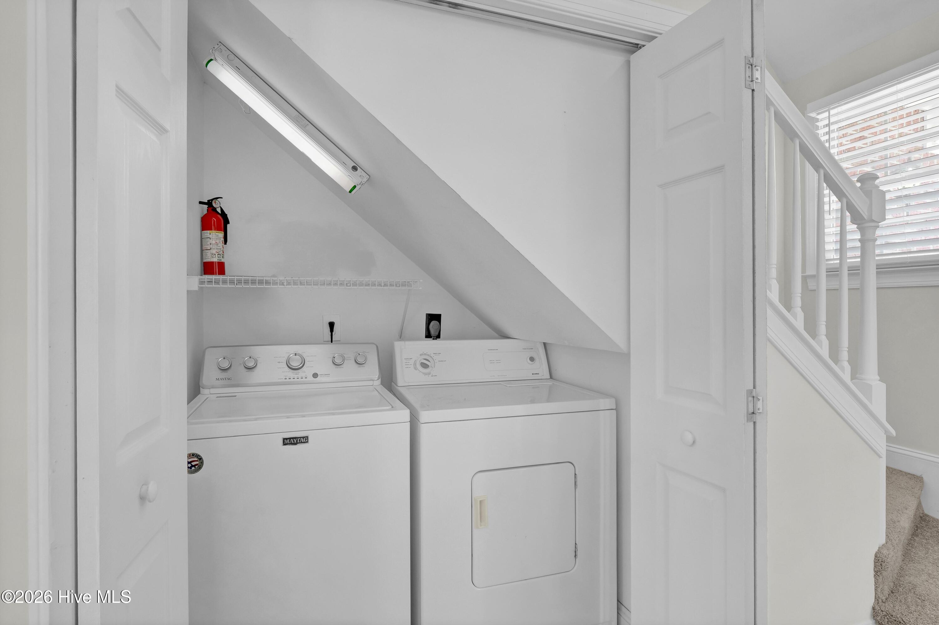 233 Racine Drive, Unit 59 Wilmington, NC 28403 - Photo 25 of 38 Laundry loated under stairway on first floor