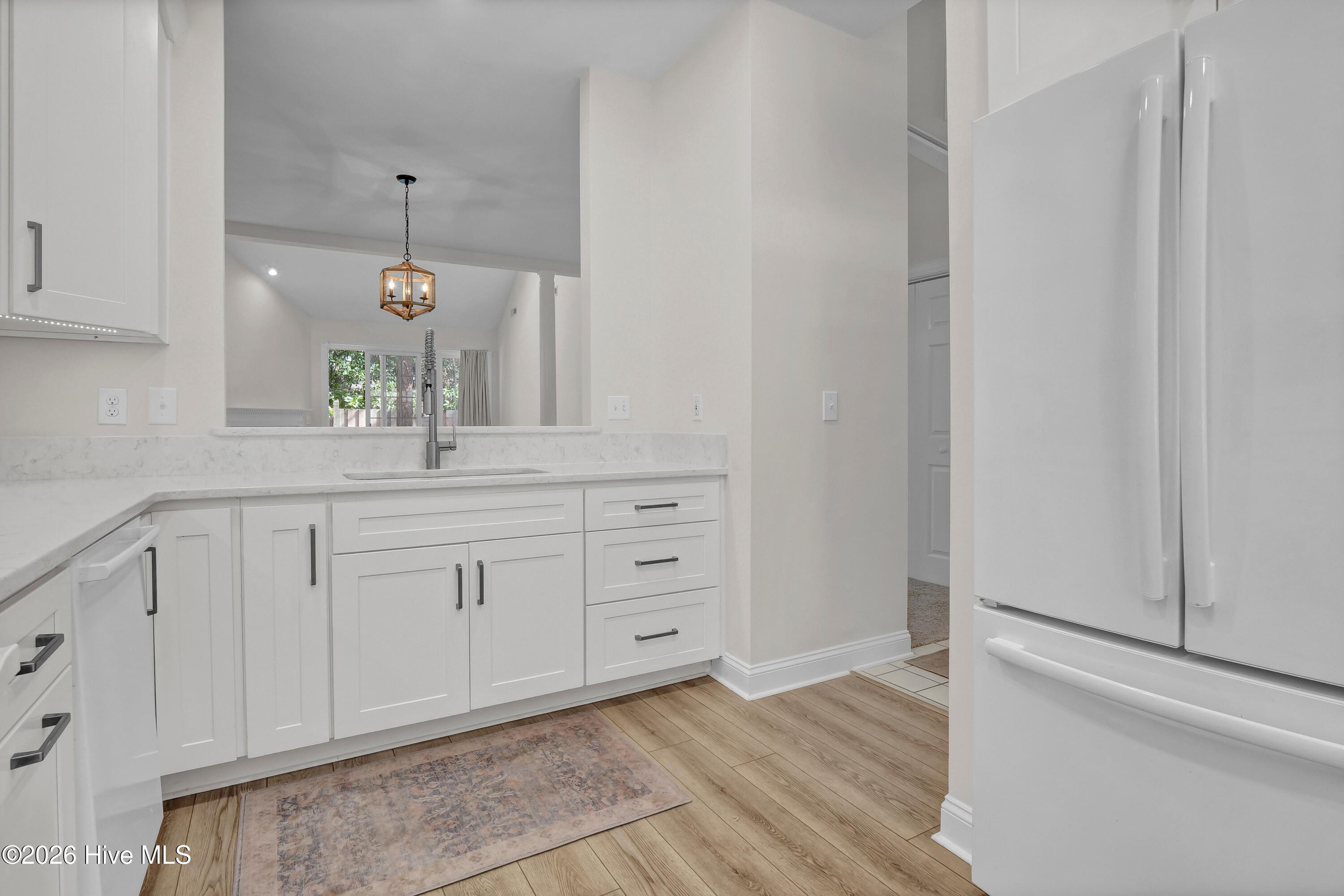 233 Racine Drive, Unit 59 Wilmington, NC 28403 - Photo 7 of 38 Kitchen opens to Dining room