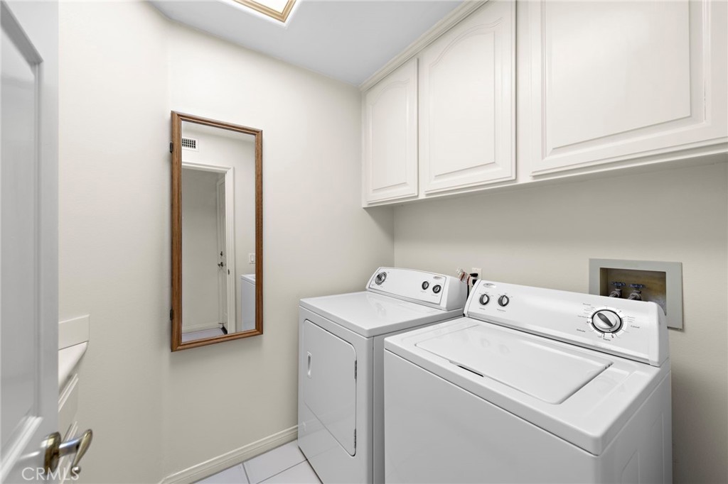 4 Charmony Laguna Niguel, CA 92677 - Photo 21 of 35 Laundry Room with Storage and a Sink