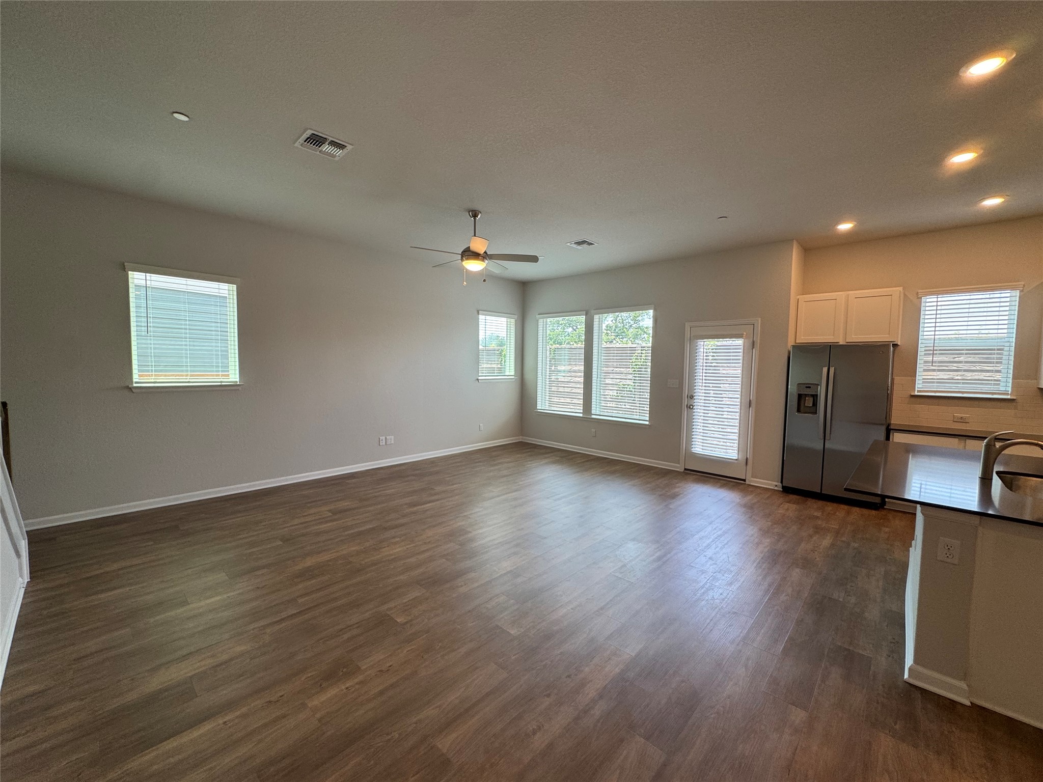 3000 Chisholm Trail Road, Unit 41 Round Rock, TX 78681 - Photo 7 of 28 A contemporary open-concept layout unites the living area and kitchen, perfect for effortless entertaining.