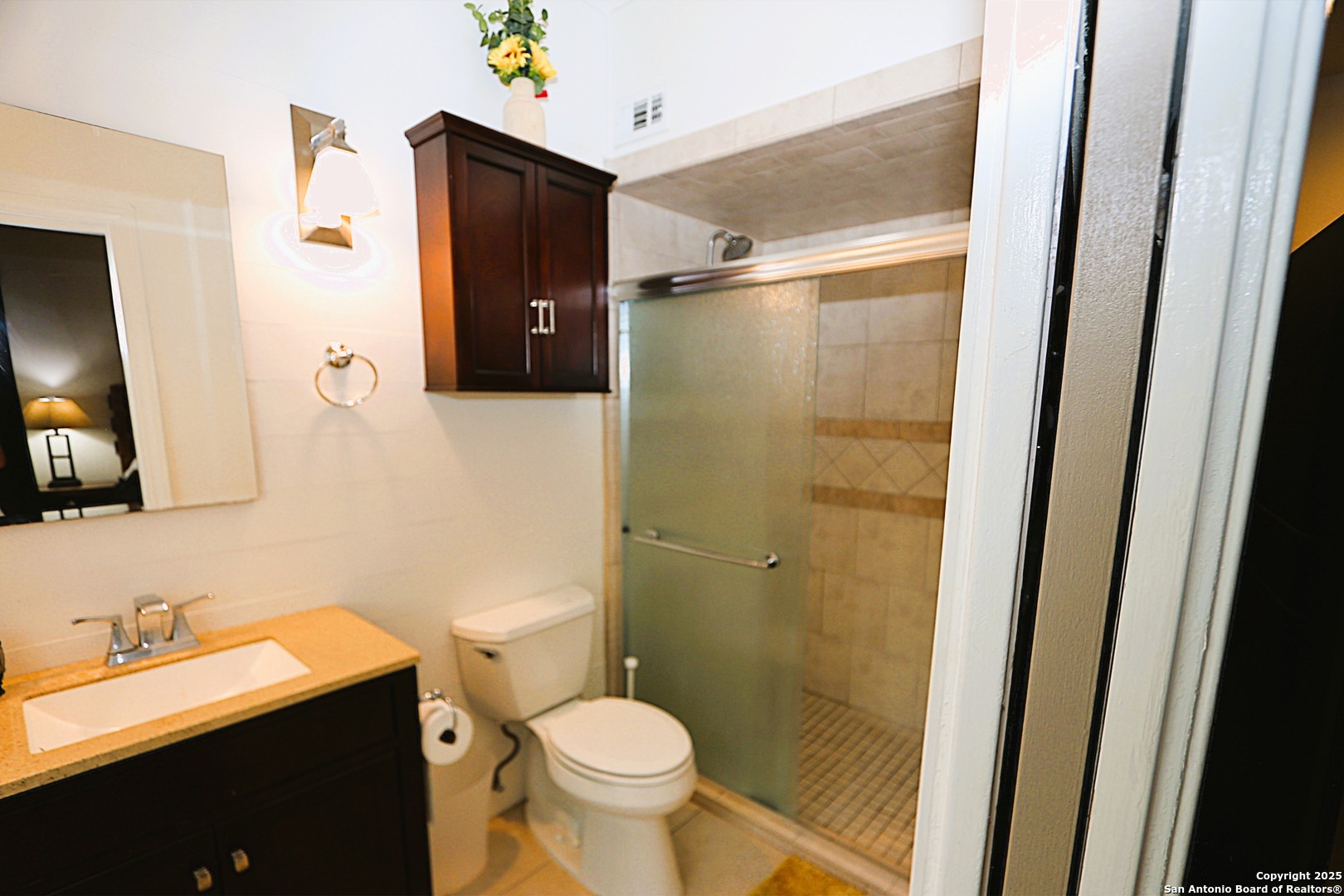 8642 Fredericksburg Road, Unit 402 San Antonio, TX 78240 - Photo 18 of 28 a bathroom with a granite countertop sink toilet and shower