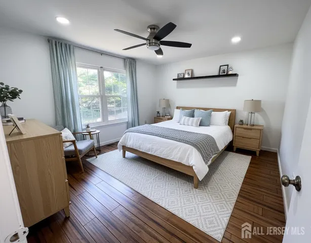 a bedroom with a bed and a couch