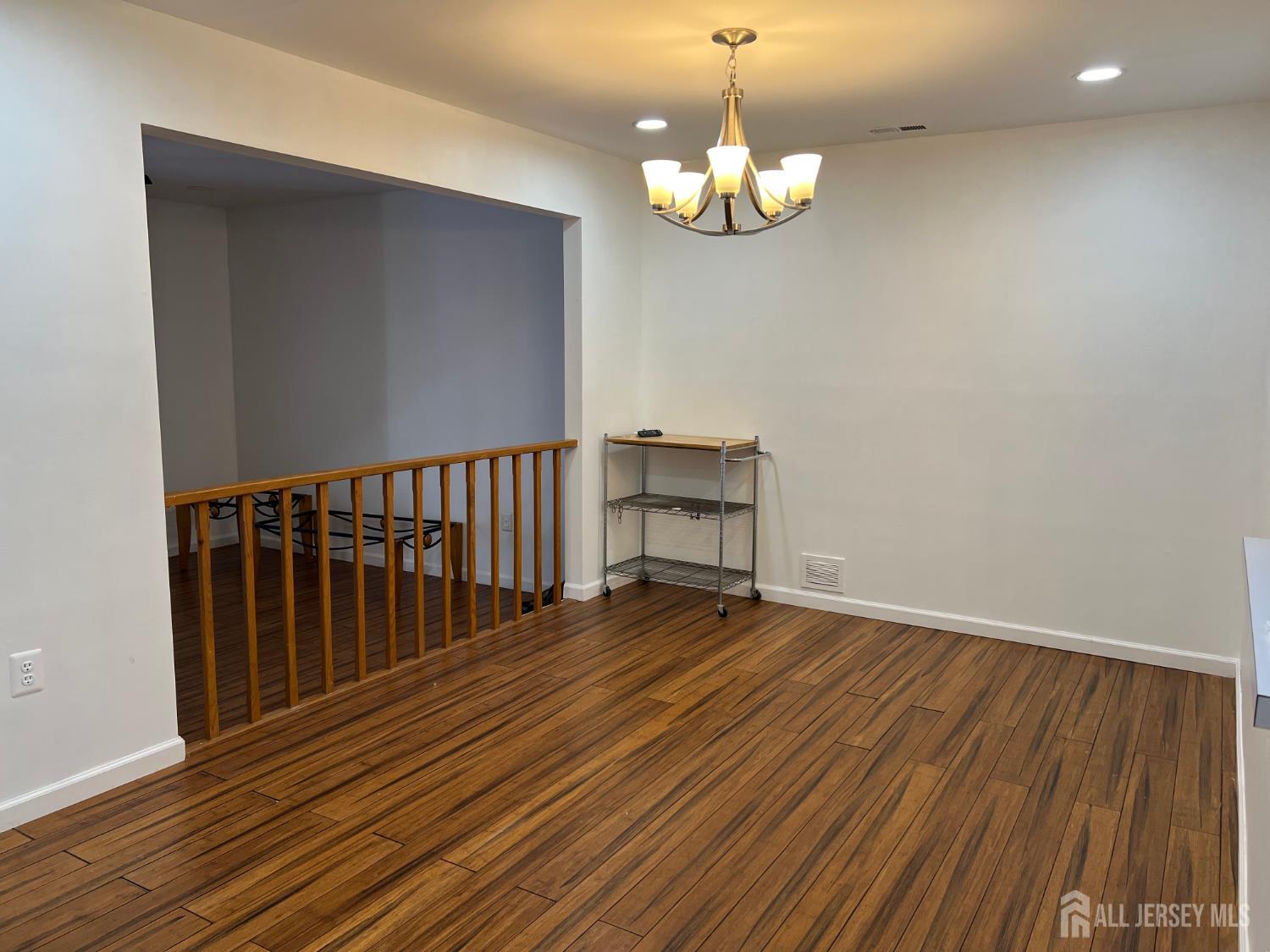68 Delancy Court North Brunswick, NJ 08902 - Photo 9 of 17 a view of a room with wooden floor and staircase