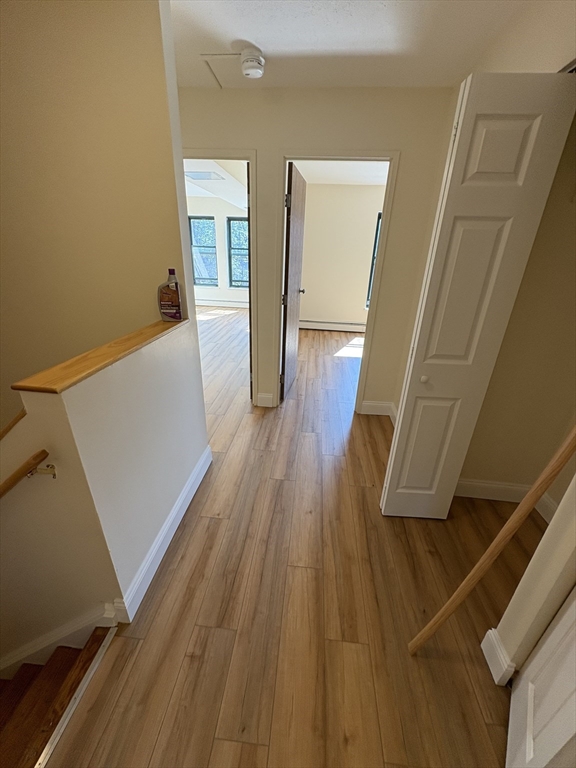 400 Massachusetts Avenue, Unit 34 Boston, MA 02115 - Photo 12 of 24 a view of a hallway and wooden floor