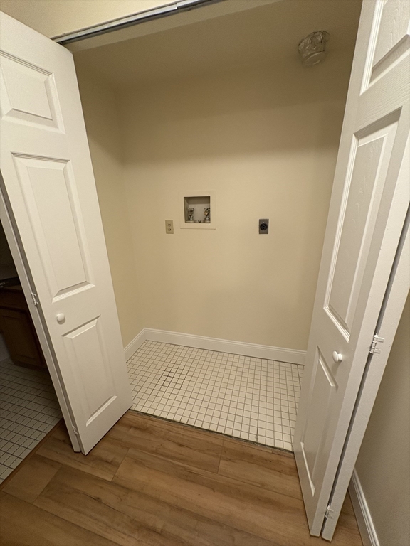 400 Massachusetts Avenue, Unit 34 Boston, MA 02115 - Photo 22 of 24 a view of an empty room with wooden floor and a window