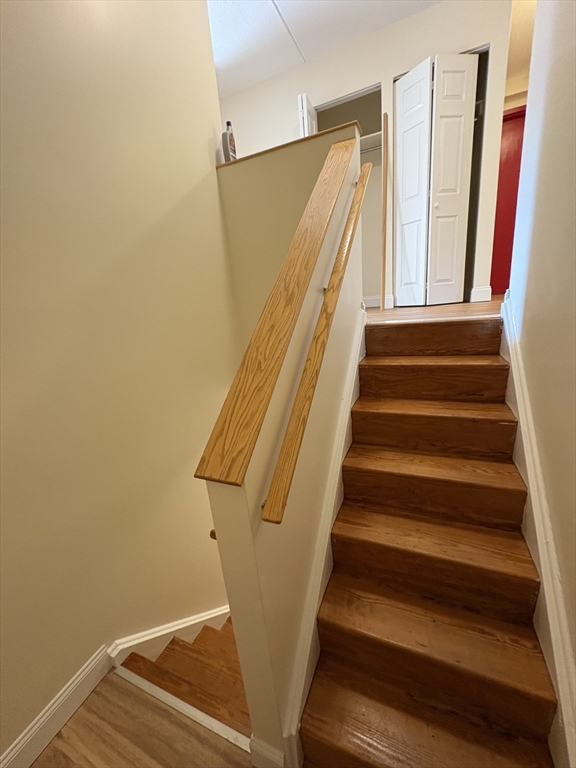 400 Massachusetts Avenue, Unit 34 Boston, MA 02115 - Photo 9 of 24 a view of staircase with railing and white walls