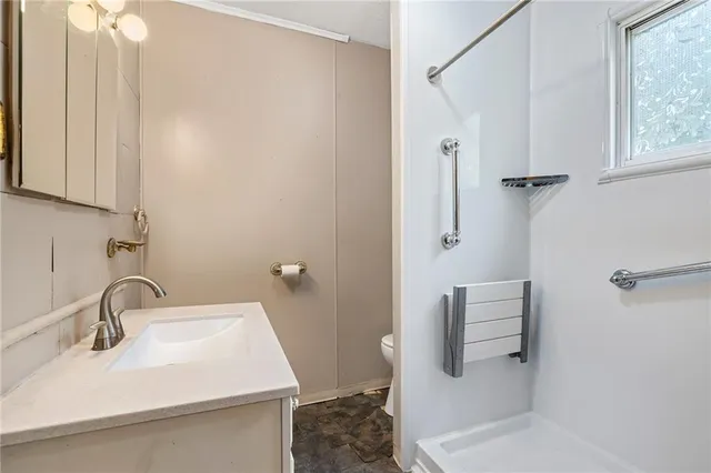 a view of an empty room with a large window