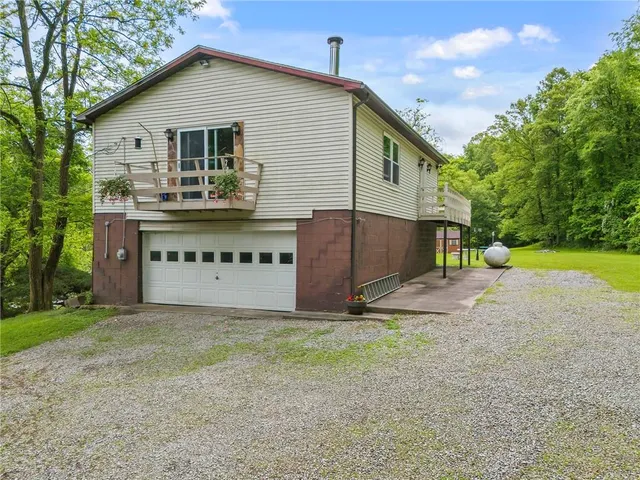 a view of a kitchen with a dining table chairs and window