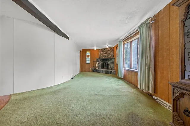 an empty room with furniture and a window