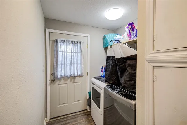 a kitchen with a stove and a refrigerator