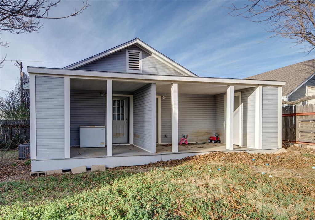 308 Cooke Street Nocona, TX 76255 - Photo 18 of 22 a front view of a house with garage