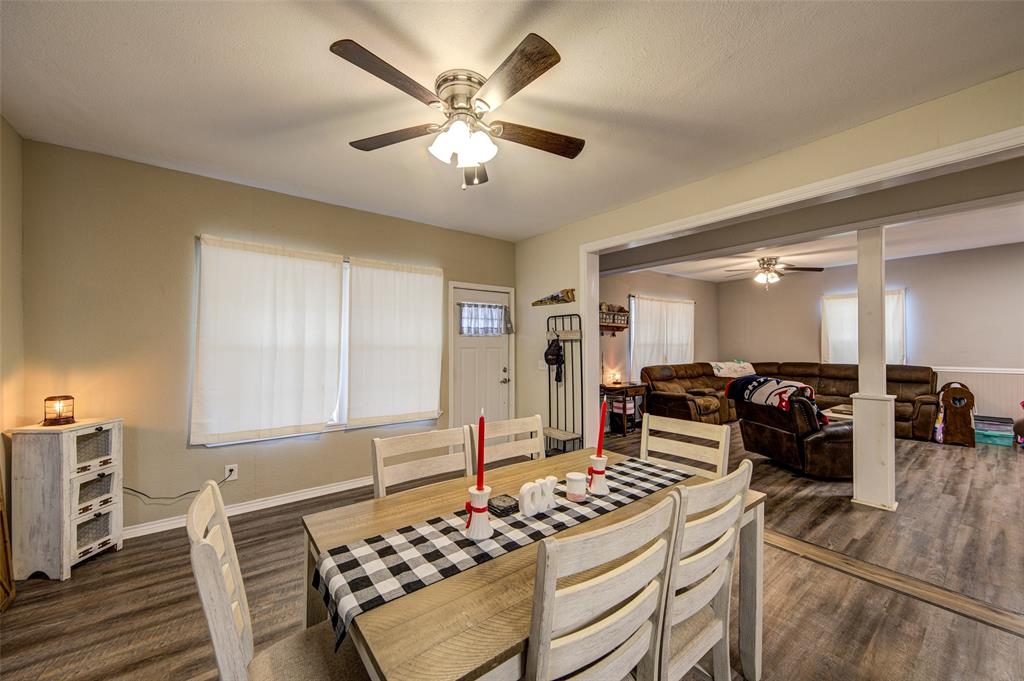 308 Cooke Street Nocona, TX 76255 - Photo 4 of 22 a living room with furniture and wooden floor