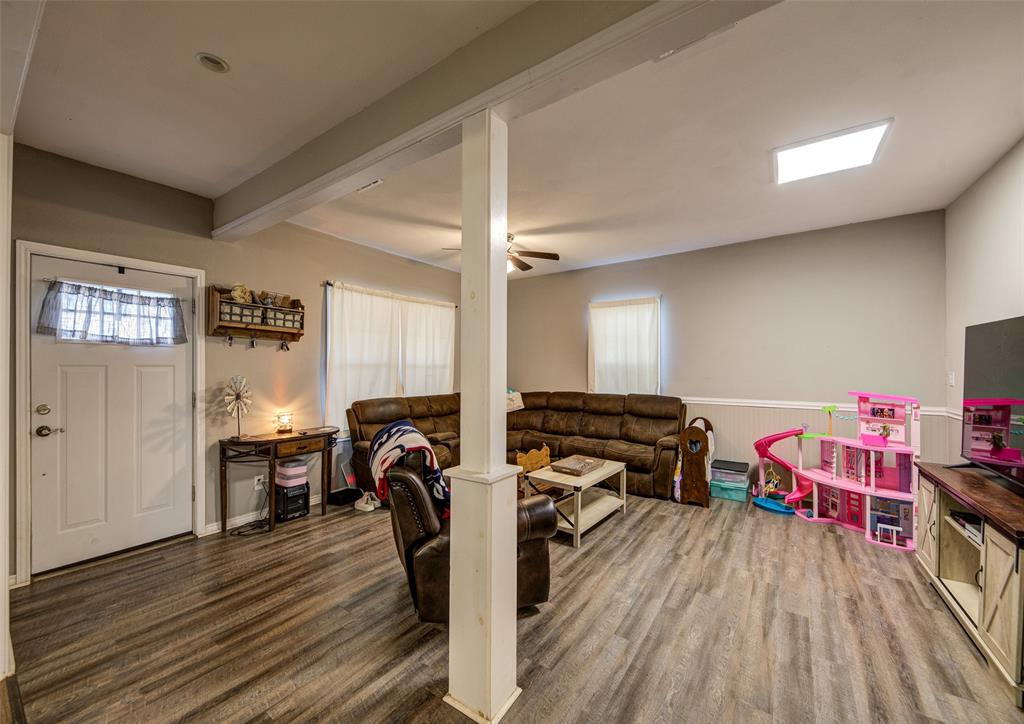 308 Cooke Street Nocona, TX 76255 - Photo 5 of 22 a view of a workspace with furniture and wooden floor