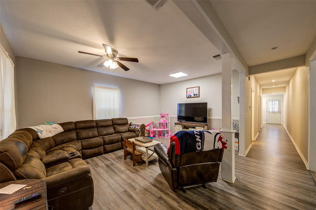 308 Cooke Street Nocona, TX 76255 - Photo 10 of 22 a living room with furniture and a flat screen tv