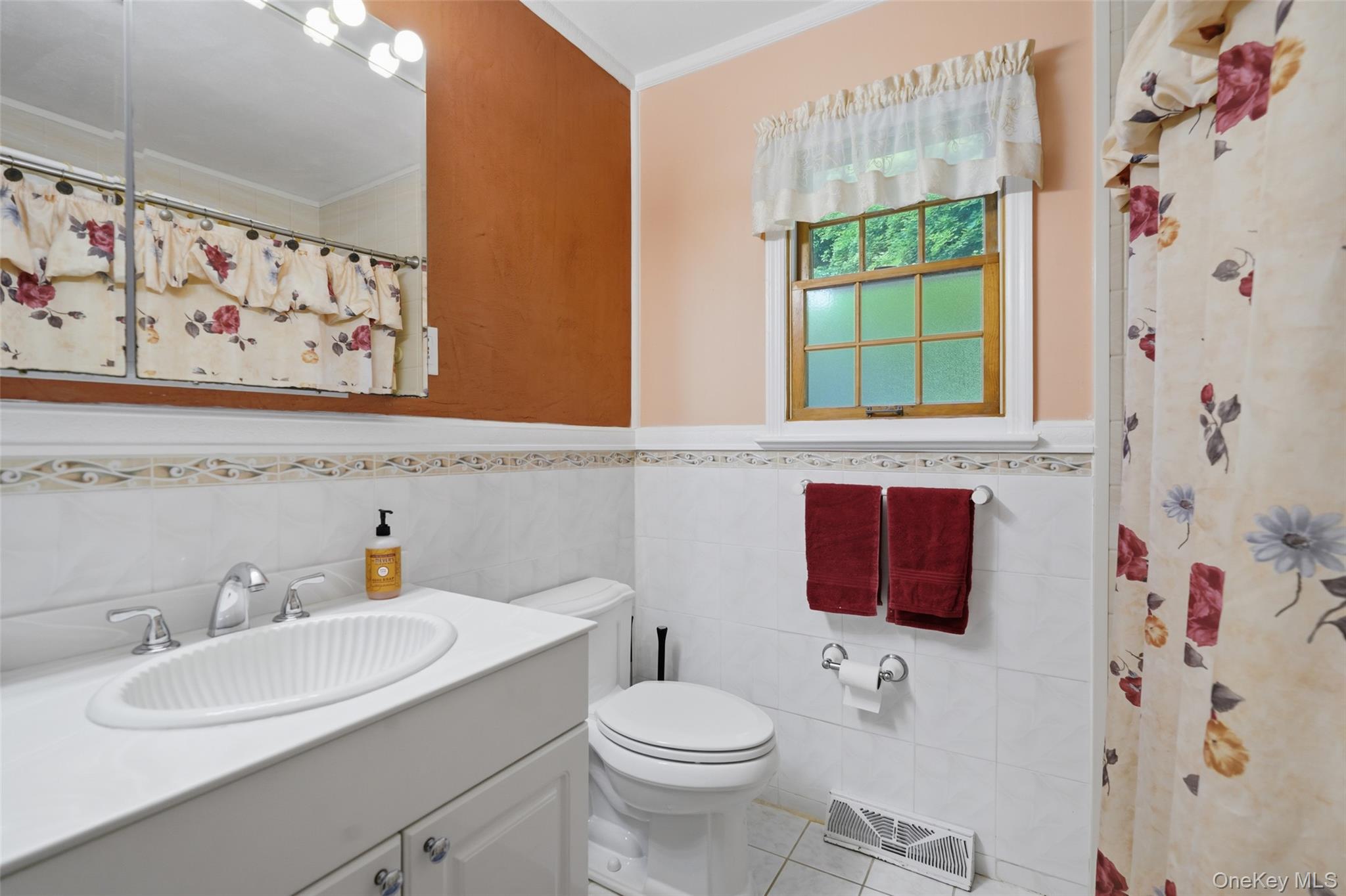 623 Cardinal Road Cortlandt Manor, NY 10567 - Photo 21 of 40 a bathroom with a sink toilet and a mirror