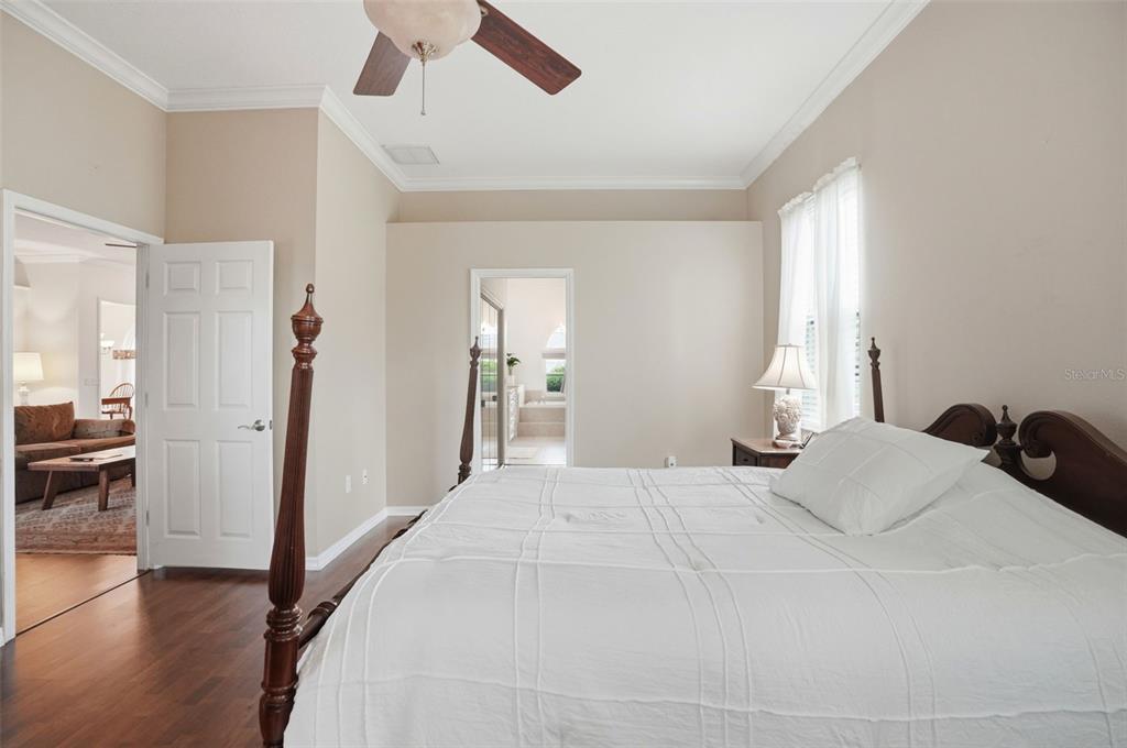 14228 Presteign Lane Spring Hill, FL 34609 - Photo 41 of 89 a bedroom with a bed and a view of bathroom