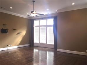 1824 Wichita Street, Unit B Houston, TX 77004 - Photo 7 of 18 a view of an empty room with window and wooden floor