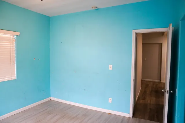 a view of a room that has a window in it