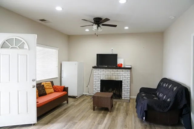a living room with furniture and a fireplace
