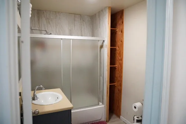 a bathroom with a bathtub and a sink