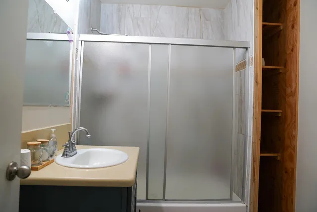 a bathroom with a sink and mirror