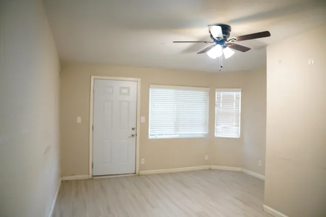 a view of an empty room with a window