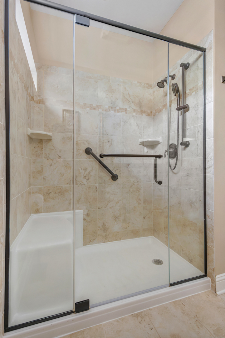 1093 Glendale Road Pingree Grove, IL 60140 - Photo 13 of 28 a bathroom with a shower and a bath tub