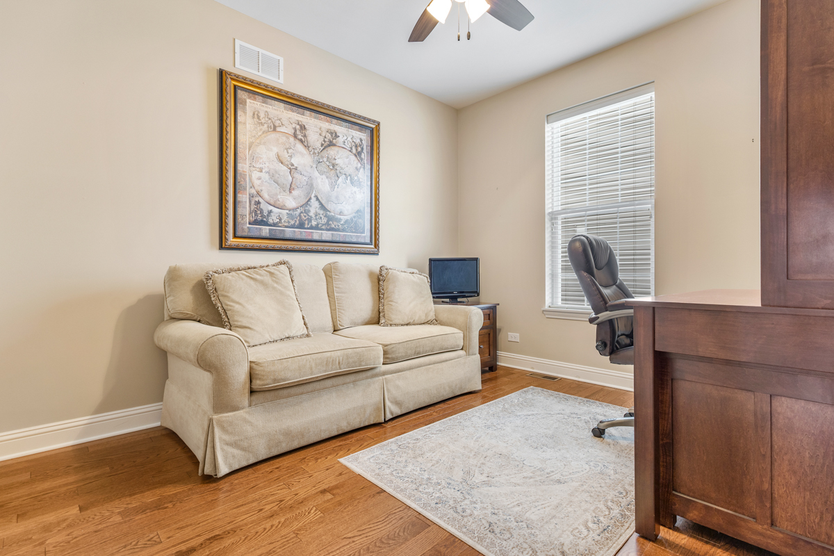 1093 Glendale Road Pingree Grove, IL 60140 - Photo 16 of 28 a living room with furniture and a window