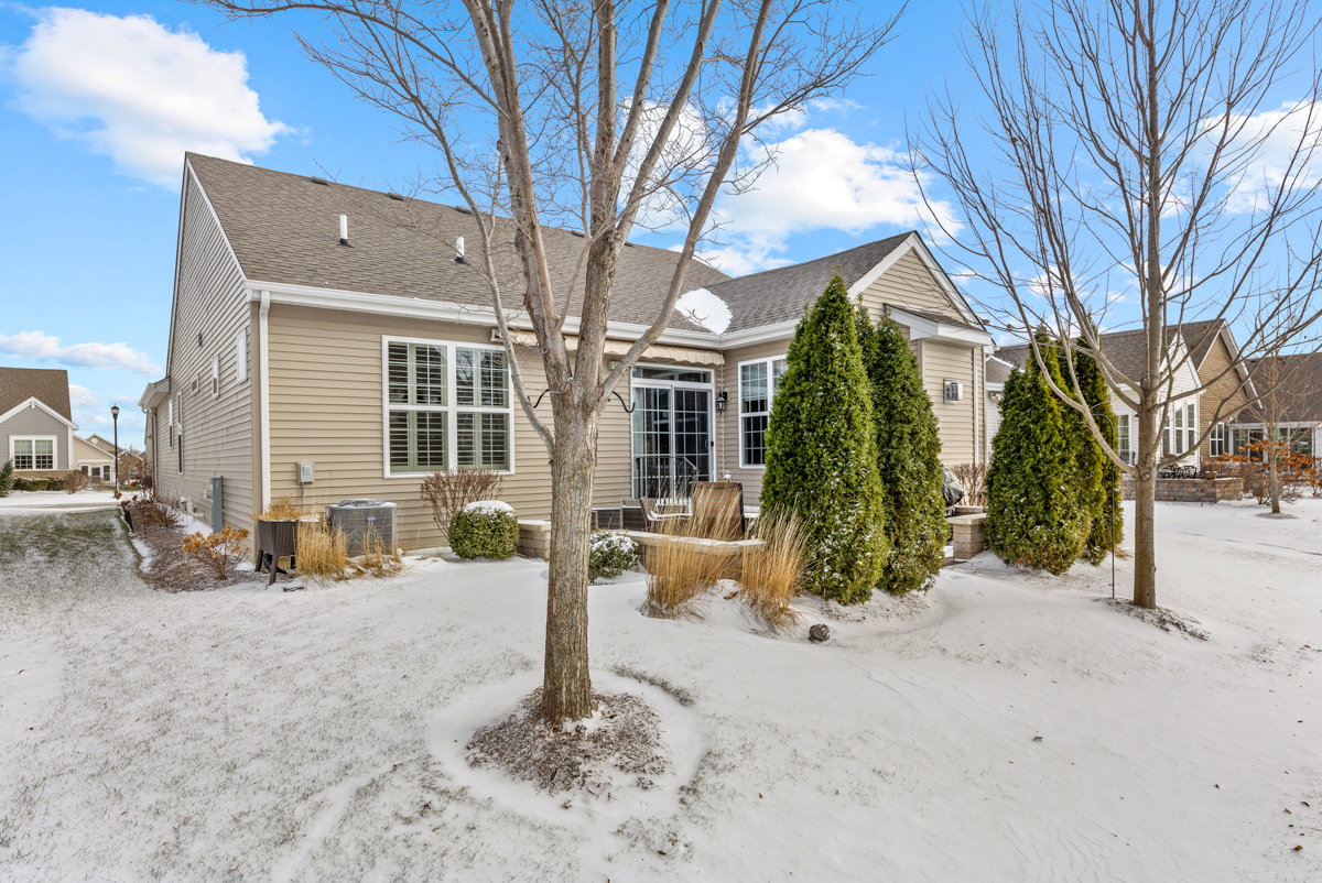 1093 Glendale Road Pingree Grove, IL 60140 - Photo 25 of 28 a front view of a house with garden and glass windows