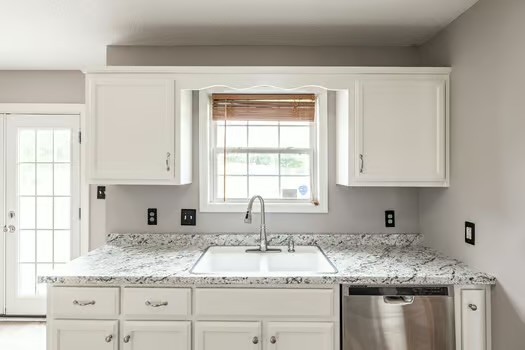 2029 Copper Kettle Circle Pleasant View, TN 37146 - Photo 21 of 58 a kitchen with granite countertop cabinets sink and window