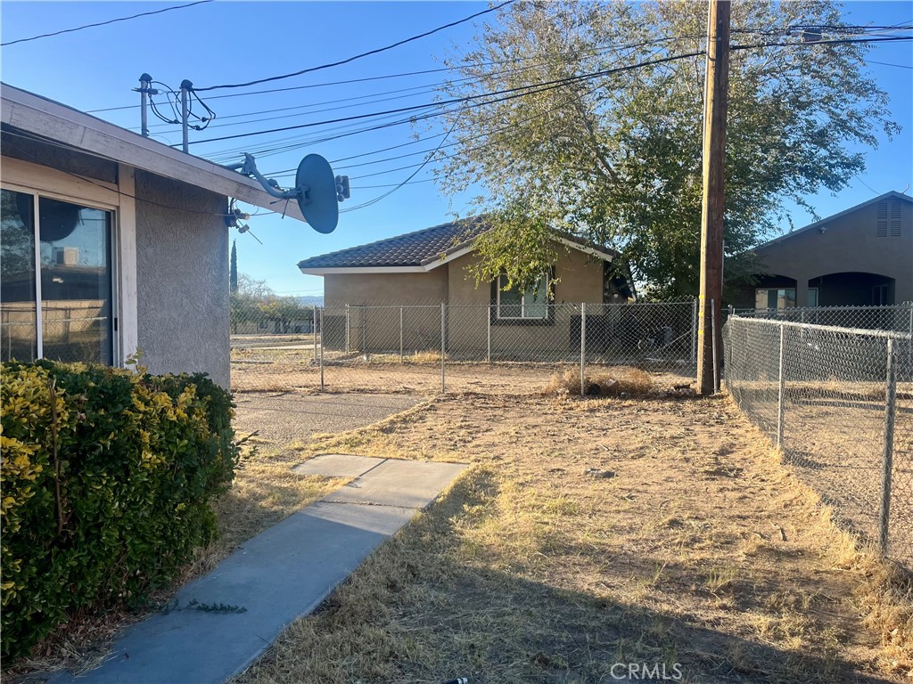 16535 Pine Street, Unit B Hesperia, CA 92345 - Photo 2 of 22 a view of a house with a yard