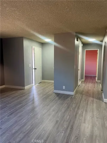 a view of a livingroom with wooden floor