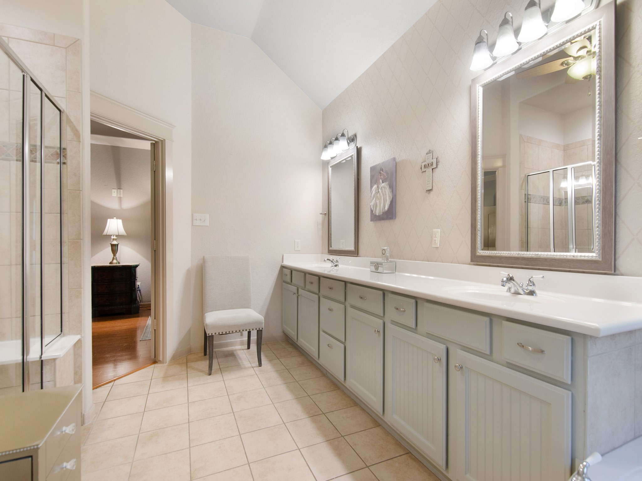 28323 Ryans Ridge Lane Spring, TX 77386 - Photo 19 of 45 A large his-and-her vanity offers extensive counter space and storage, providing a functional layout designed for busy mornings.