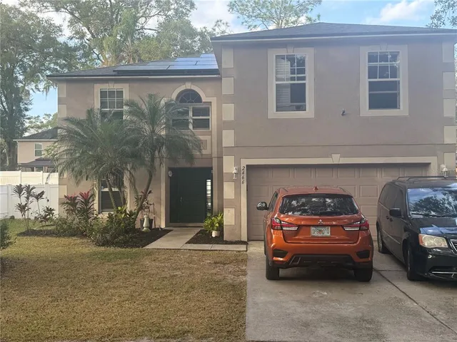 a car parked in front of a house