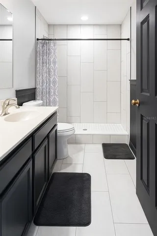 a bathroom with a sink a toilet and a bathtub