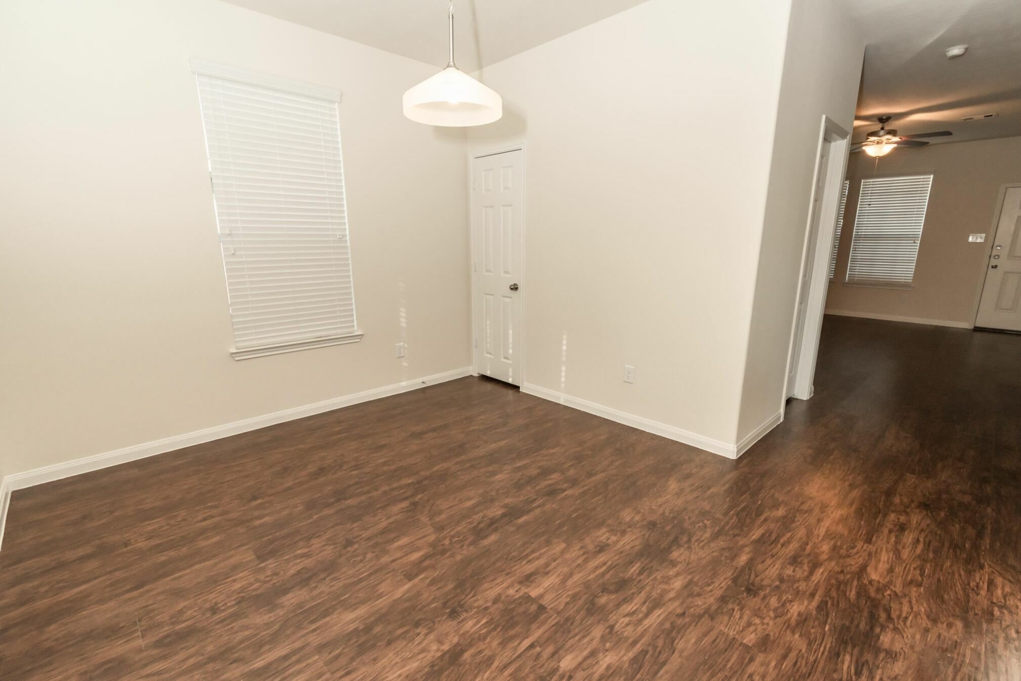 47 Santa Barbara Drive Manvel, TX 77578 - Photo 8 of 15 an empty room with wooden floor and windows