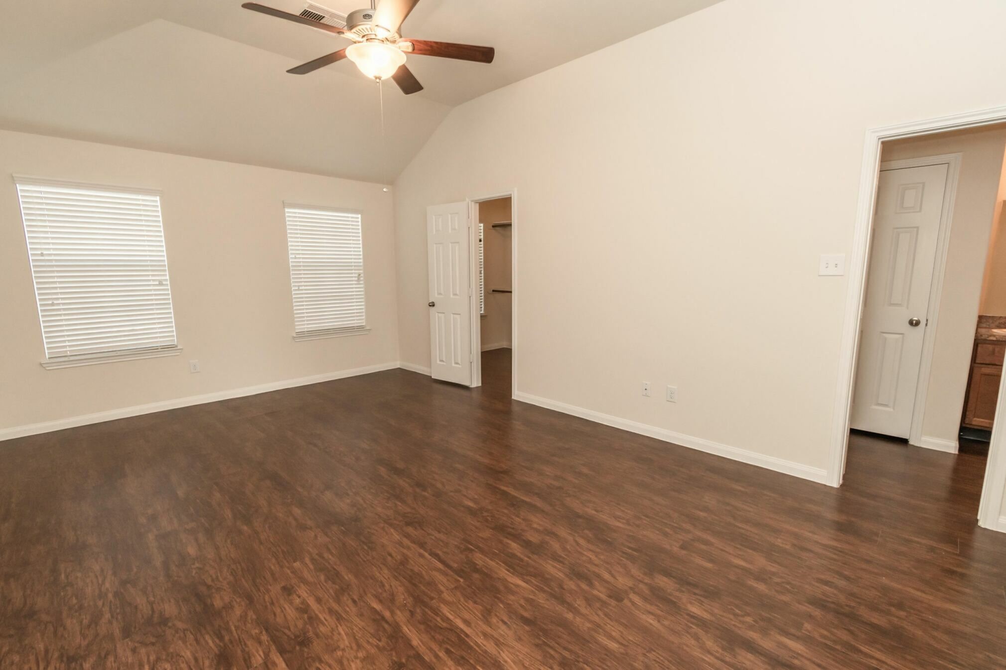 47 Santa Barbara Drive Manvel, TX 77578 - Photo 10 of 15 an empty room with wooden floor fan and windows