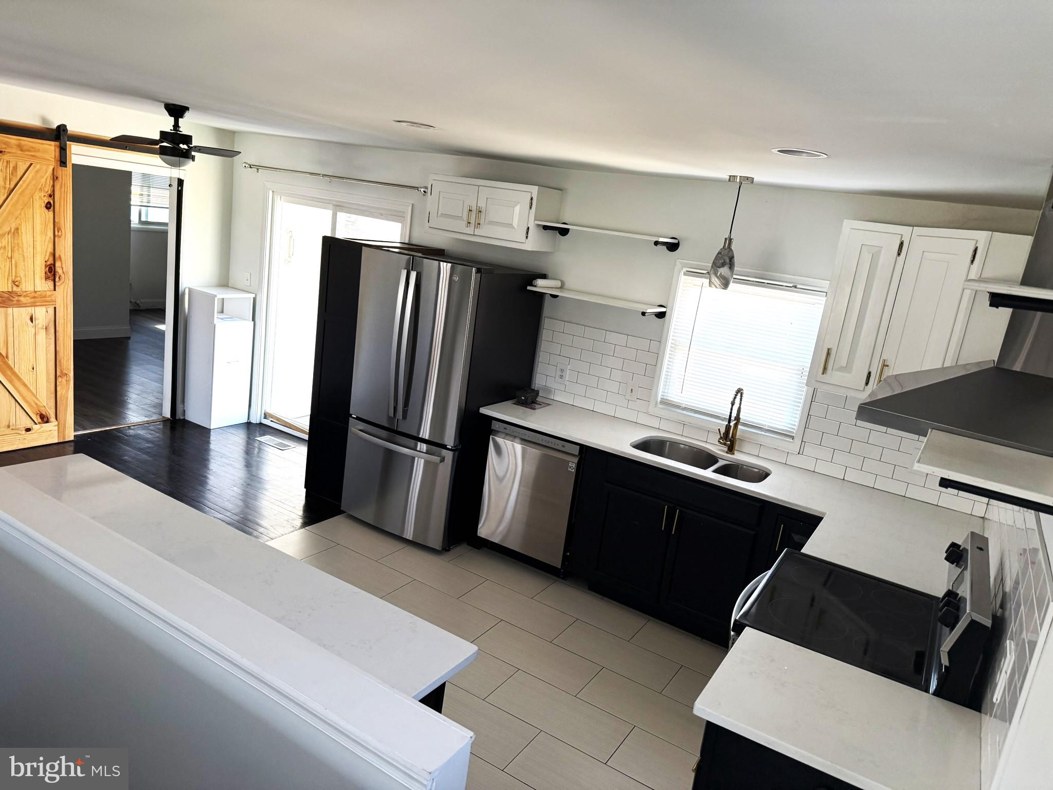 240 Federalsburg South Laurel, MD 20724 - Photo 15 of 36 a kitchen with granite countertop a refrigerator and a sink