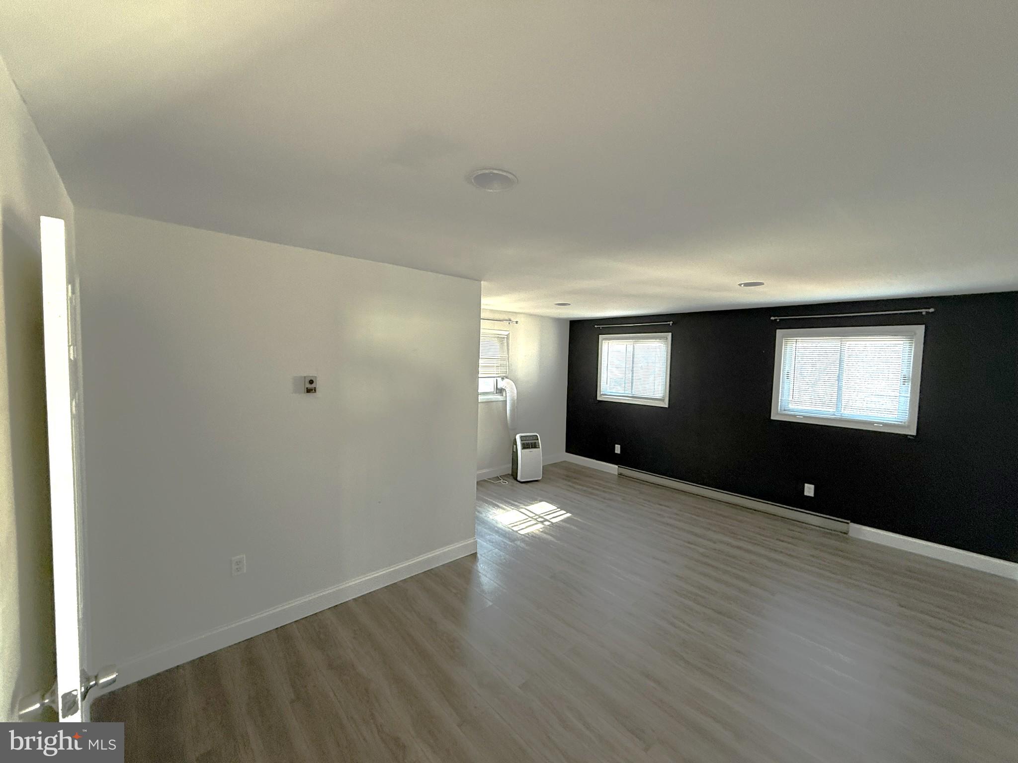 240 Federalsburg South Laurel, MD 20724 - Photo 18 of 36 an empty room with wooden floor and windows
