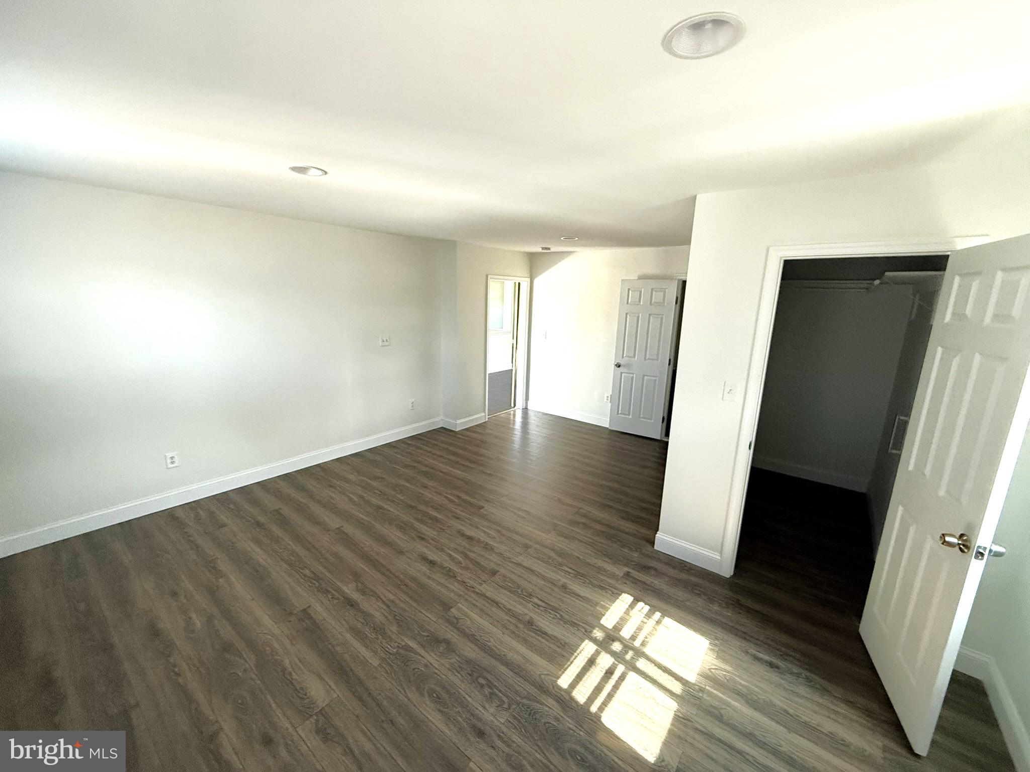240 Federalsburg South Laurel, MD 20724 - Photo 19 of 36 an empty room with wooden floor and windows