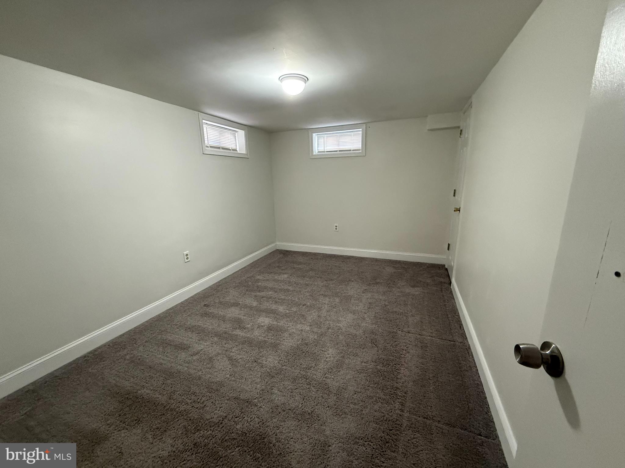 240 Federalsburg South Laurel, MD 20724 - Photo 35 of 36 an empty room with a wooden door and shower